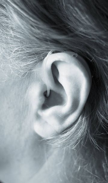 Deaf lady with modern technology digital hearing aid in her ear. - Photo, Image