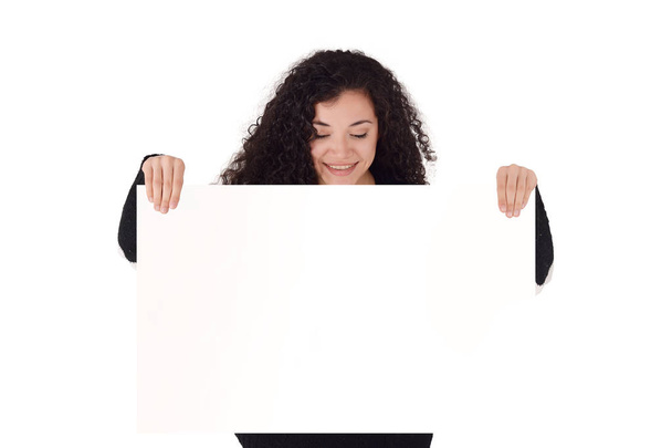 Young latin woman holding a blank note. Isolated white background. - Fotó, kép