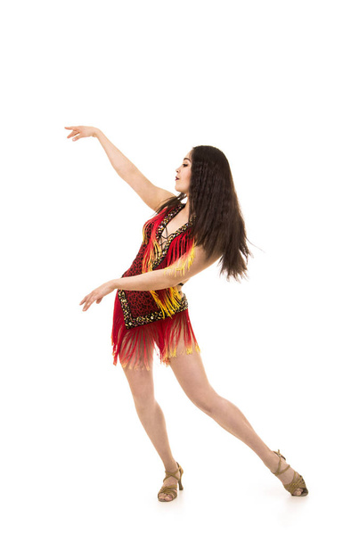 A young girl, with long dark hair, dances and performs in an airy ring in a stage costume. Studio shooting, isolated image. - Foto, imagen