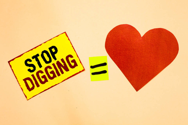 Handwriting text writing Stop Digging. Concept meaning Prevent Illegal excavation quarry Environment Conservation Yellow piece paper reminder equal sign red heart sending romantic feelings. - Photo, Image