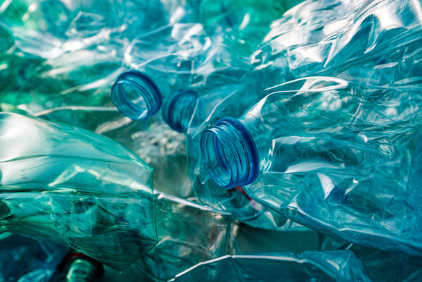 Crushed plastic bottles heap ready for recycling - Foto, imagen