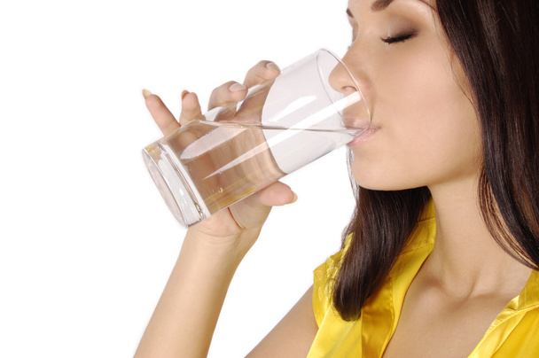 Beautiful woman drinks water from glass - Foto, Imagem