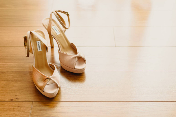 Wedding shoes on their wedding isolated in a room - Φωτογραφία, εικόνα