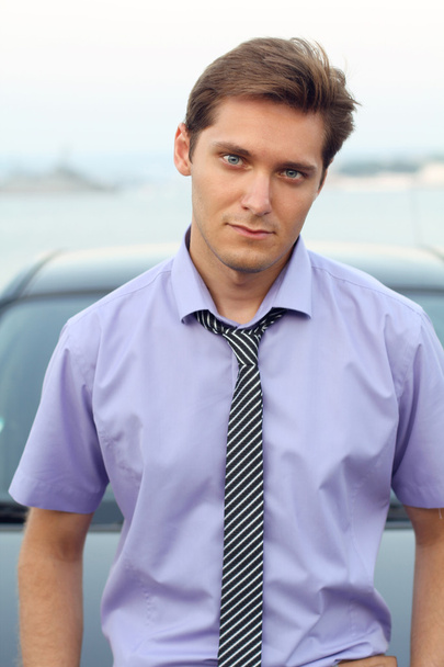 Handsome Man casually leaning against the car, outdoor portrait - Photo, image