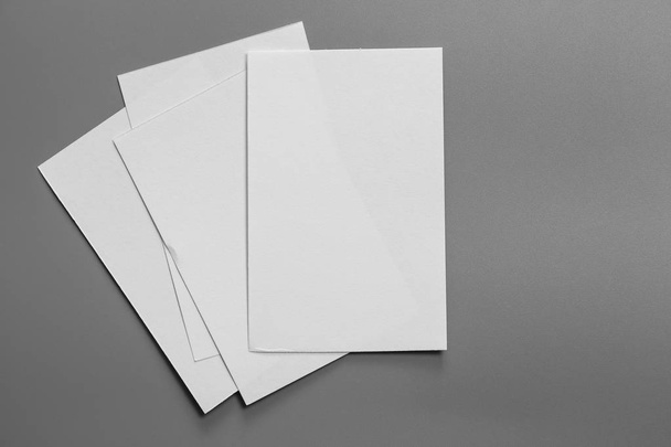 Blank portrait mock-up paper. brochure magazine isolated on gray, changeable background / white paper isolated on gray - 写真・画像