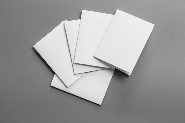 Blank portrait mock-up paper. brochure magazine isolated on gray, changeable background / white paper isolated on gray - Photo, Image