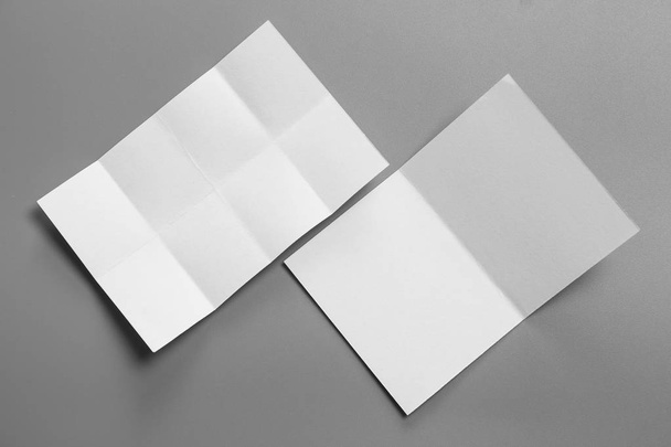 Blank portrait mock-up paper. brochure magazine isolated on gray, changeable background / white paper isolated on gray - Foto, afbeelding