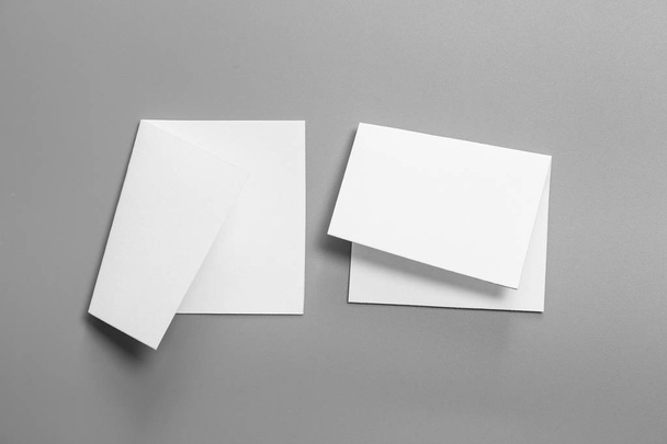 Blank portrait mock-up paper. brochure magazine isolated on gray, changeable background / white paper isolated on gray - Fotografie, Obrázek