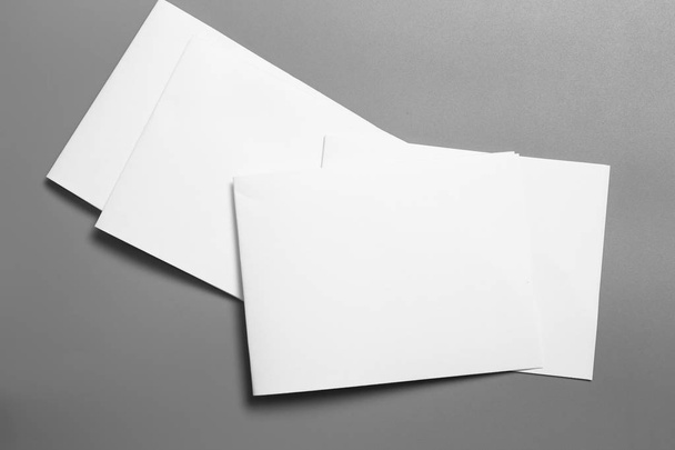 Blank portrait mock-up paper. brochure magazine isolated on gray, changeable background / white paper isolated on gray - Photo, image