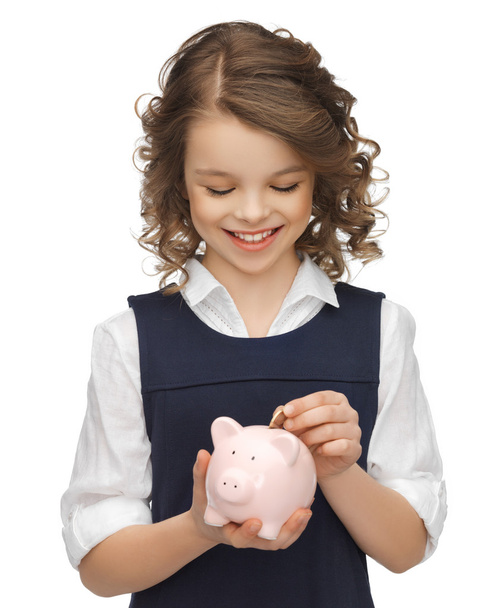 Girl with piggy bank - Фото, зображення