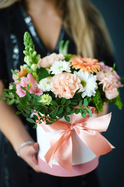 nice bouquet in the hands of woman  - Foto, Imagen