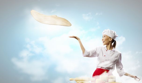 Asian female cook making pizza - Foto, immagini