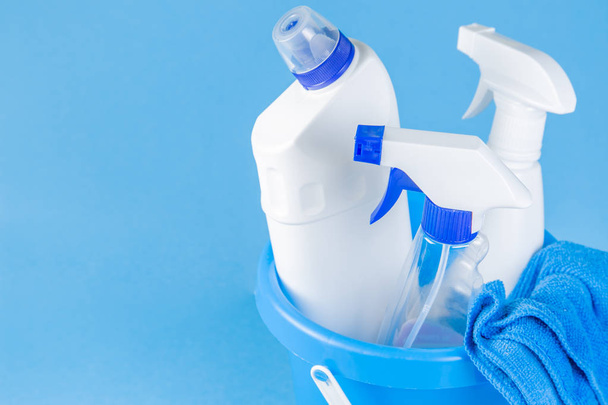Cleaning supplies - bottles, sprays sponge on bright pastel background - Zdjęcie, obraz