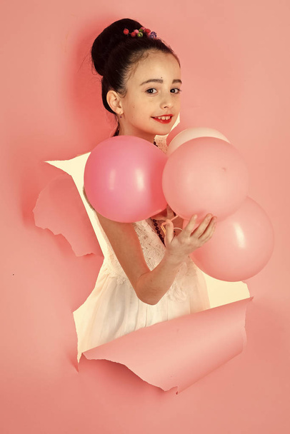 Little girl with hairstyle hold balloons. little girl with party balloons - Photo, Image
