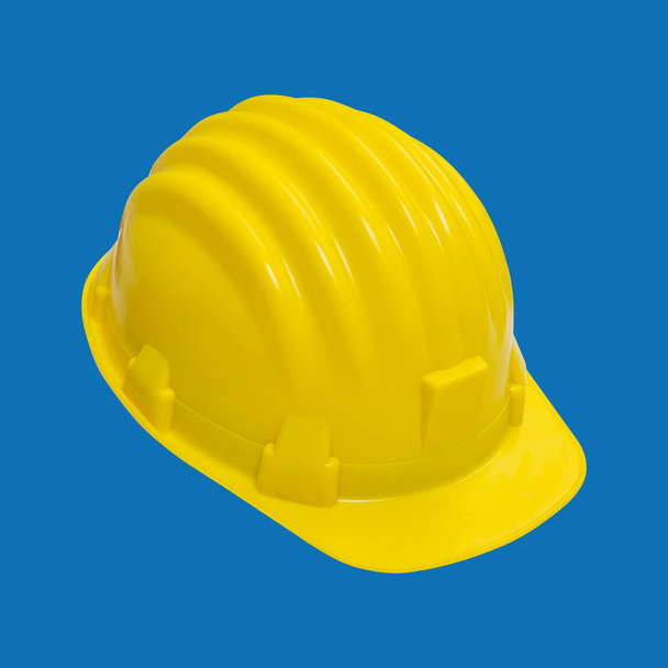 Жовтий шолом ізольовані. на синьому фоні з відсікання шлях вид зверху. Жовті капелюхи для робітників і Земля рухається операторів. - Фото, зображення