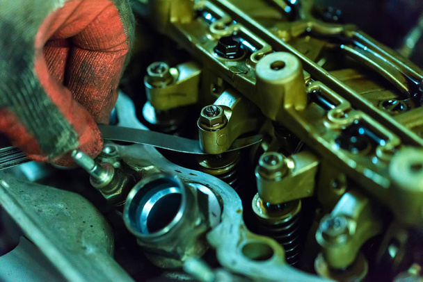 Maintenance check and adjust valve lash in car engine - Foto, Imagem