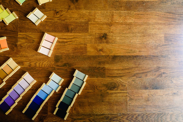 Montessori color tablets on wooden floor background - Zdjęcie, obraz