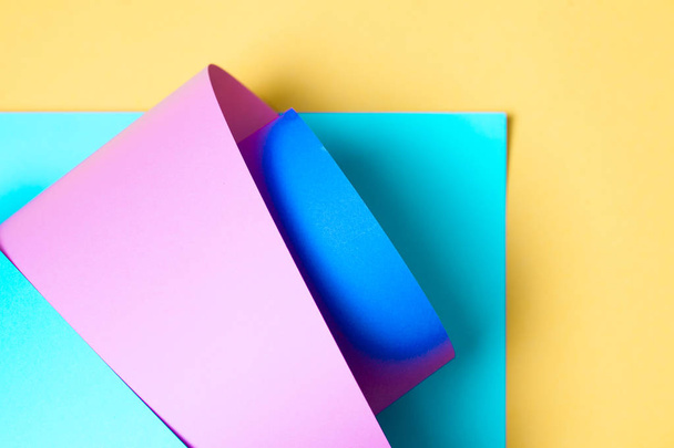 Abstract creative Colorful paper background. Blue, pink and yellow colors. - 写真・画像