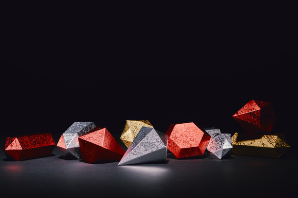 red, silver and golden glittering minerals on black background - Photo, Image