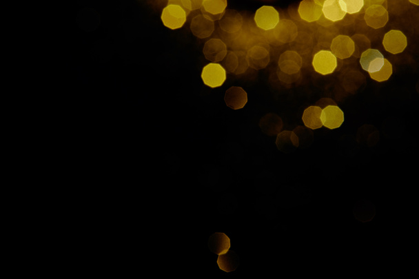 abstract dark background with gold bokeh   - 写真・画像