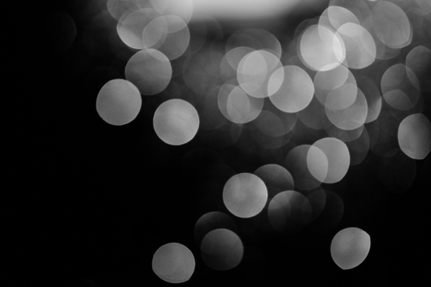 Glowing Silver Bokeh On Black Festive Background Free Stock Photo and Image