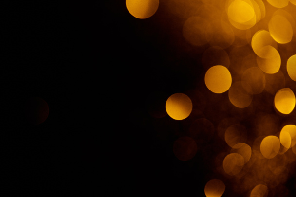 abstract dark background with beautiful gold bokeh and copy space - Fotó, kép