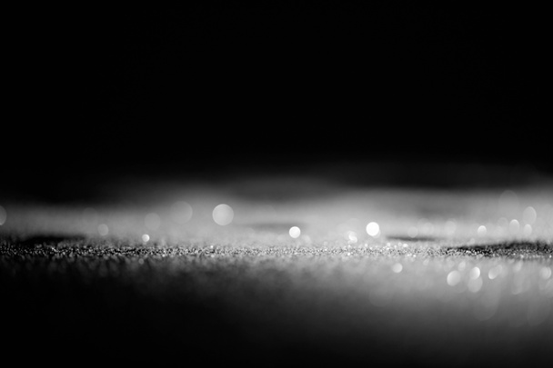 absztrakt fényes ezüst csillámpor sötét háttér - Fotó, kép