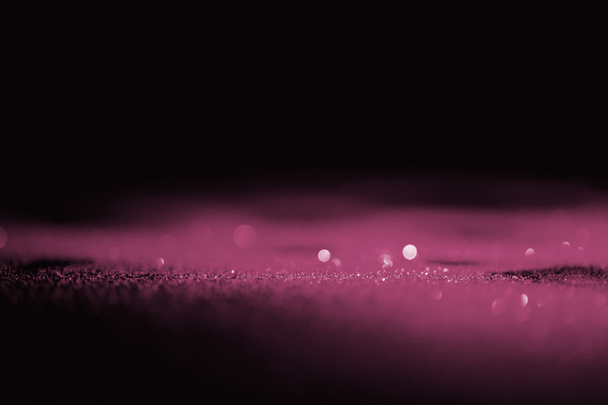 abstract shiny pink glitter on dark background with copy space - Photo, Image
