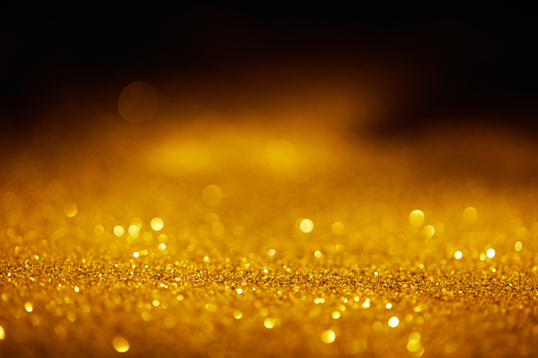 absztrakt homályos arany csillogó sötét háttér - Fotó, kép