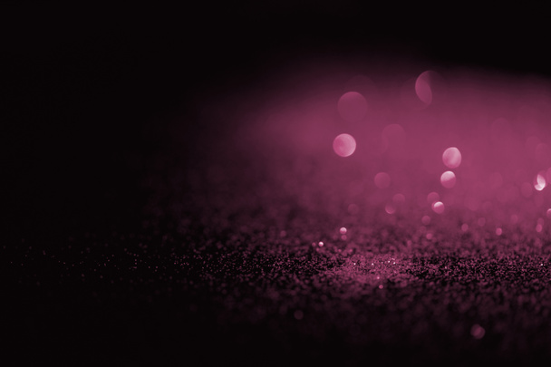 θολή ροζ glitter σε σκούρο φόντο - Φωτογραφία, εικόνα
