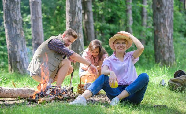 Healthy snack. Woman straw hat sit meadow hold apple fruit. Healthy life is her choice. Girl enjoy picnic with healthy snack apple fruit nature background. Girl with friends at picnic in forest - Foto, imagen