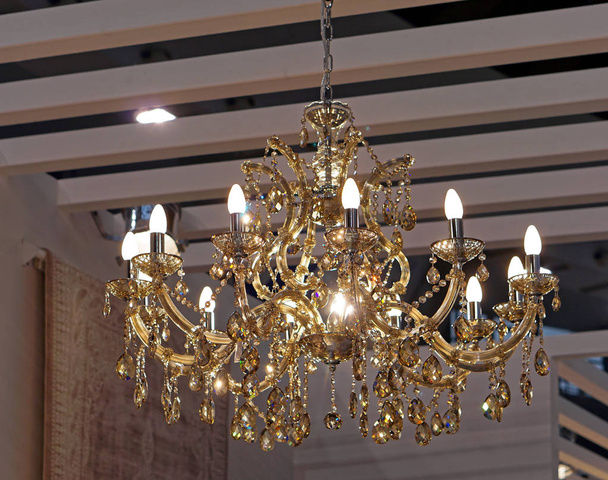 Golden crystal chandelier with energy saver lamps - Photo, Image