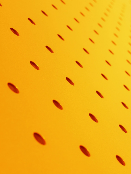 Placa perforada naranja
 - Foto, Imagen