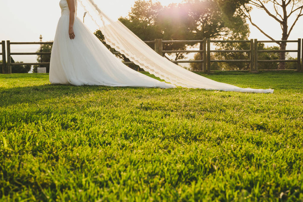 Detail of a white and elegant wedding dress. - Φωτογραφία, εικόνα