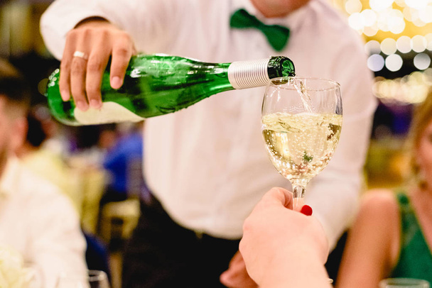 Glasses of champagne served from the bottle at a wedding - Photo, Image