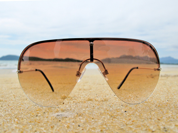 Sun glasses on the sand of Langkawi island, Malaysia - Photo, Image