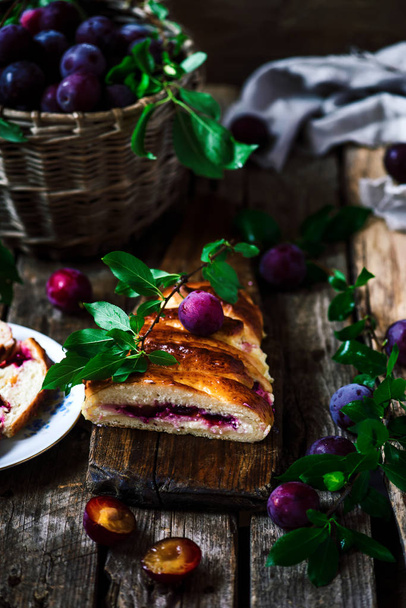 hala with plums and cottage cheese.. . Dark rustic photo.selective focus - Φωτογραφία, εικόνα