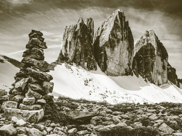 Stones gravel stack bellow Alpine mountain summit. Spring trail around Tre Cime di Lavaredo, well known also as Drei Zinnen , Dolomite Alps, Italy. Europe - Foto, Imagen