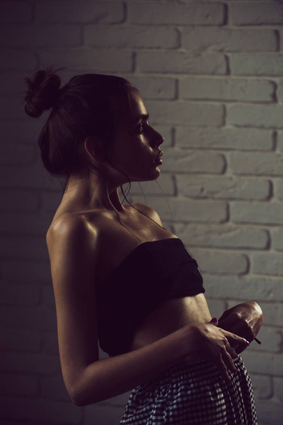 girl with hair bun and oily or wet skin - Valokuva, kuva