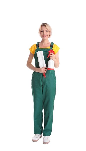 Female janitor with cleaning supplies on white background - Photo, Image