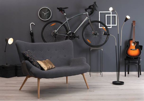 Stylish room interior with bicycle and sofa - Zdjęcie, obraz