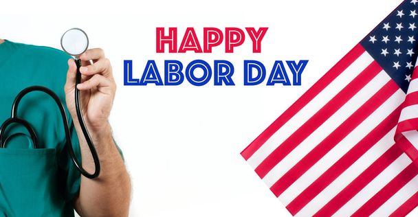 Doctor with a stethoscope in the hand on white background and  USA flag. Happy Labor Day. - Zdjęcie, obraz