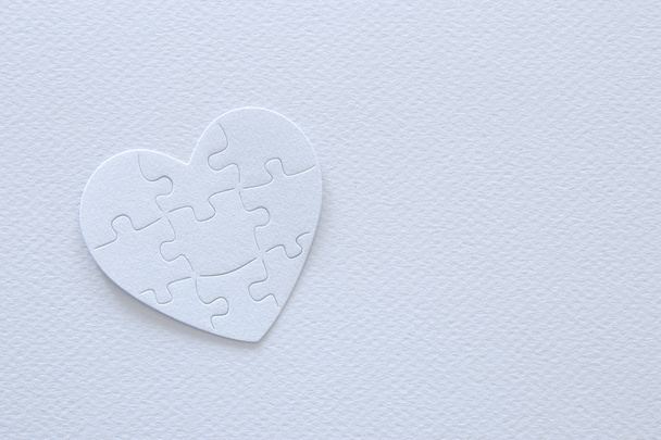 Top view image of paper white heart puzzle. Health care, donate, world heart day and world health day concept - Photo, image
