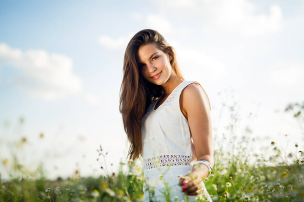 Young beautiful happy woman spending time in nature - Фото, зображення