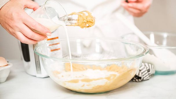 Step by step. Mixing ingredients for vanilla cupcakes. - Fotó, kép
