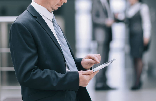 businessman uses a digital tablet in the office - Фото, зображення