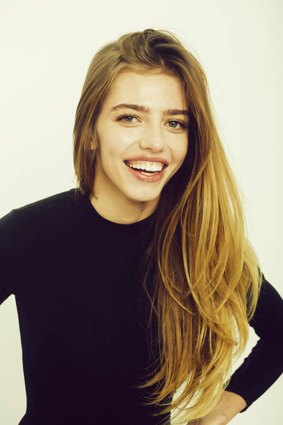 Happy pretty girl with long blond hair in black - Foto, afbeelding