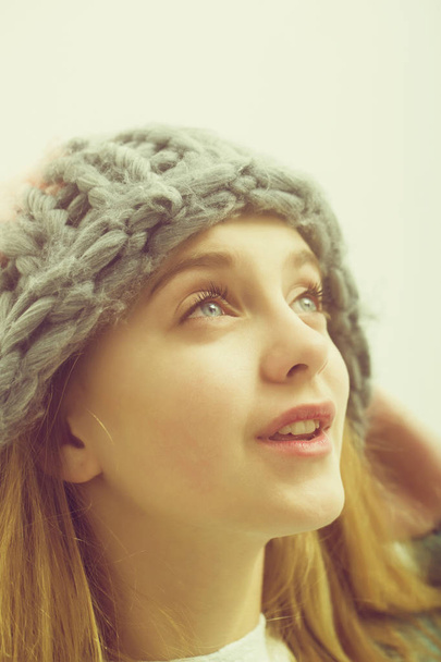 Pretty young smiling girl with blond hair in fashionable hat - Фото, изображение