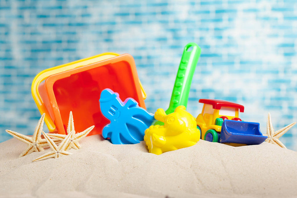 front view of childrens toys on sand - Photo, Image