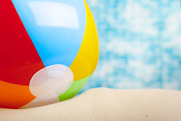 Close up of beach ball on sand - Zdjęcie, obraz